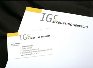 A brand identity for an accounting firm composed of a yellow rectangle and a logotype saying IGC, colours are yellow, grey and black.
