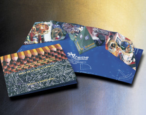 A 3D pop-up brochure – an exhibition stand pops up when you open the LP-sized yellow-and-black brochure. Graphic design and paper-engineering by Barry Adamson. Client: Expocolour Displays & Exhibitions