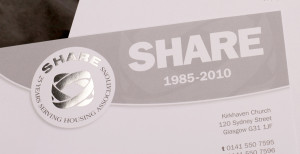 Picture shows top corner of the SHARE 25th Anniversary letterhead, a grey-on-white design featuring a silver metallic foil-blocked logo.