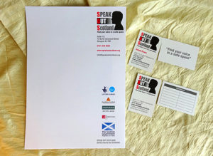 This photo shows business stationery – A4 letterhead and two types of business card – printed with Speak Out Scotland’s new brand identity.
